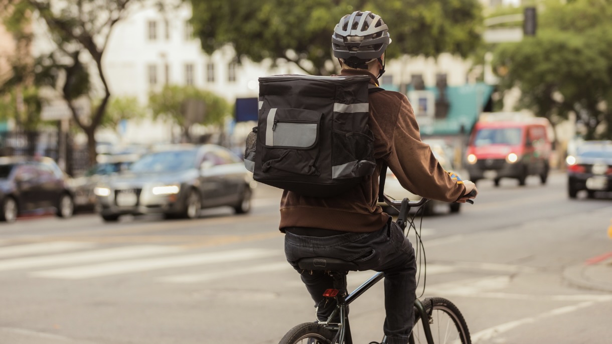 image of a food delivery worker on a bike